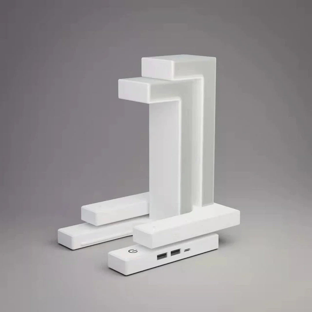A modern, levitating desk lamp with wireless charging capabilities for smartphones