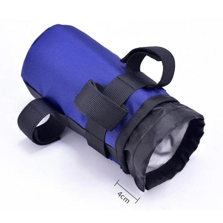 Insulated gray handlebar bag securely holding a 750ml water bottle, designed for easy access to hydration while cycling