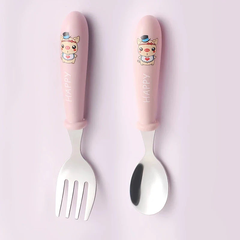 Charming cartoon-designed stainless steel toddler cutlery set with spoon and fork, perfect for mealtimes and self-feeding
