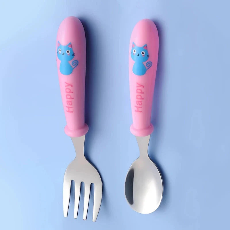 Charming cartoon-designed stainless steel toddler cutlery set with spoon and fork, perfect for mealtimes and self-feeding