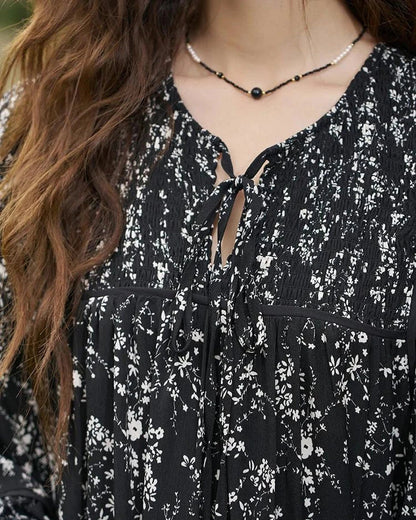 Floral print dress with flare sleeves, knee-length design, and loose, comfortable fit