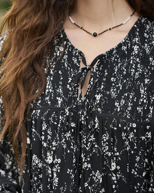 Floral print dress with flare sleeves, knee-length design, and loose, comfortable fit