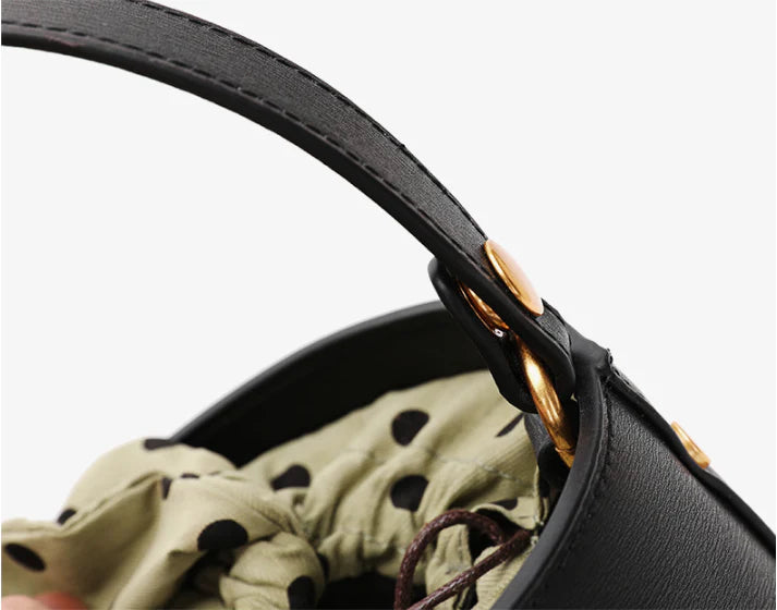 Premium leather bucket bag tote with bow-type closure, exquisite golden hardware, and versatile design