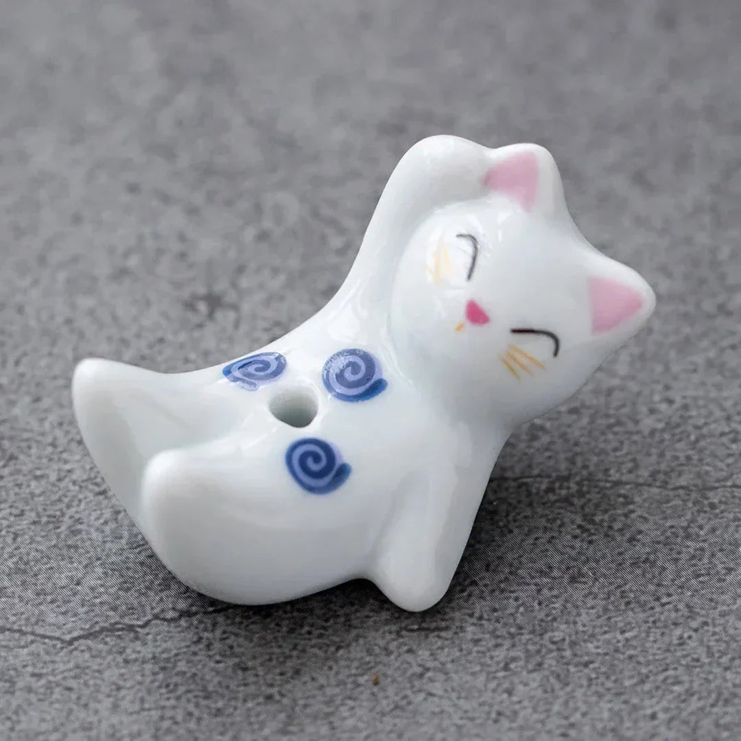 Charming ceramic incense holder featuring a cute rabbit and kitten design, perfect for adding a touch of whimsy and tranquility to any room.