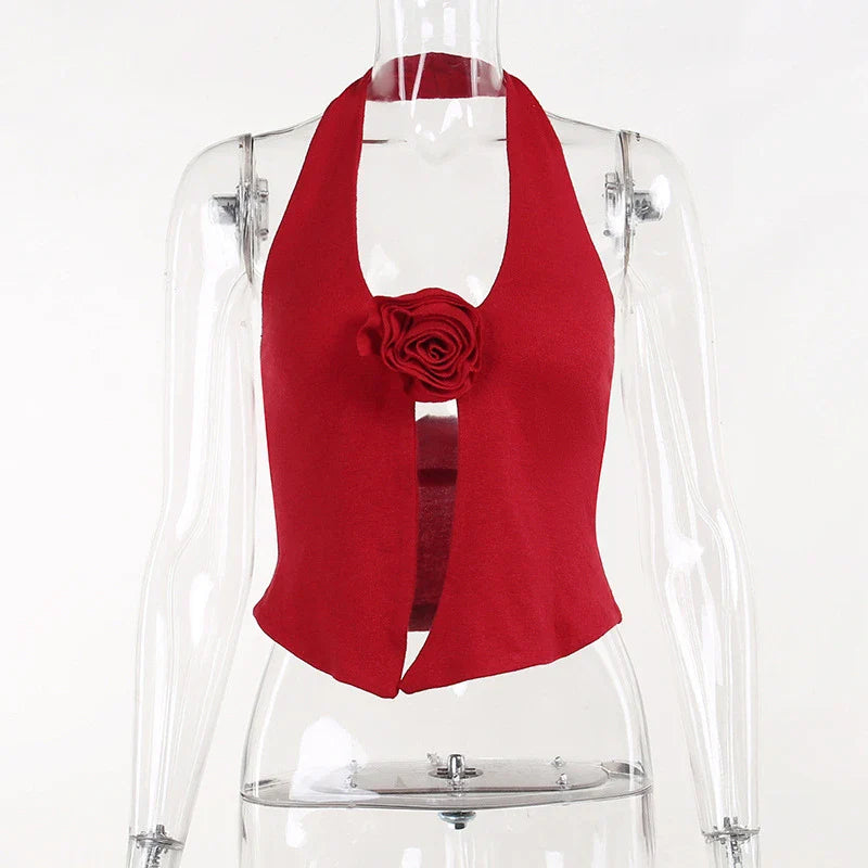 Chic knit halter vest with a captivating 3D floral pattern, delivering a trendy and versatile look for any occasion.