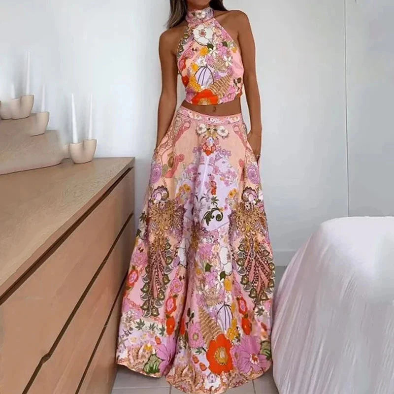 Stylish sleeveless midi skirt suit with vibrant floral print, featuring a half-turtleneck design and comfortable A-line silhouette.