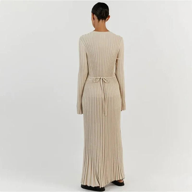 Timeless elegant pleated knit dress in black, perfect for summer office wear with a sophisticated and comfortable design.