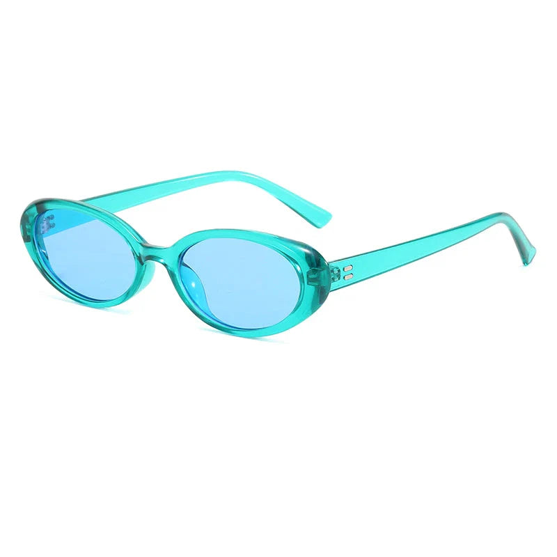 Chic oval sunglasses with white grey acetate frames and polycarbonate lenses, designed for fashionable women to shield their eyes from UV rays in style.