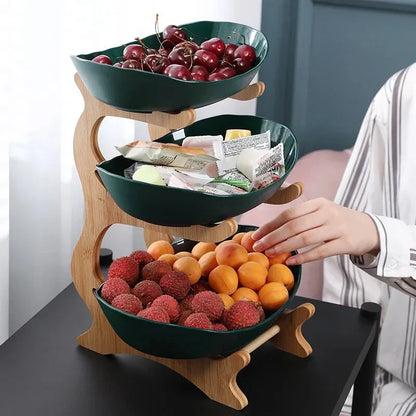 Three-tier plastic and bamboo fruit display tray with unique leaf-shaped design, available in white, beige, and green colors