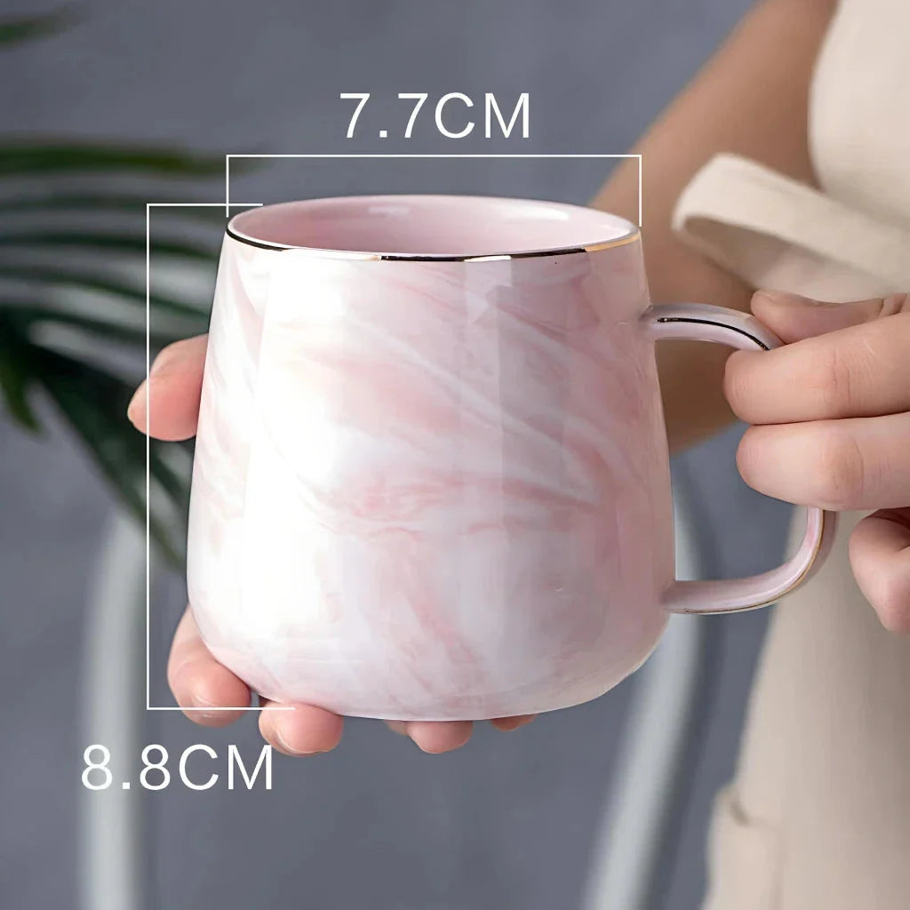 Elegant marble pattern ceramic mug with a gold rim, perfect for coffee, tea, and other hot and cold beverages