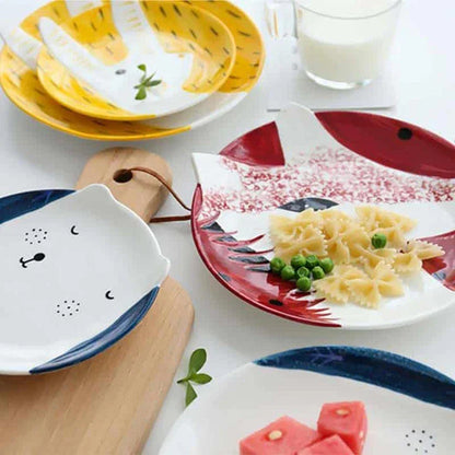 Charming ceramic plate with whimsical animal patterns, available in small and large sizes, perfect for serving meals and snacks.
