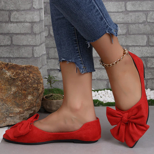 Fashionable flat shoes with bow accent, pointed toe, and low heel for comfortable, slip-on wear