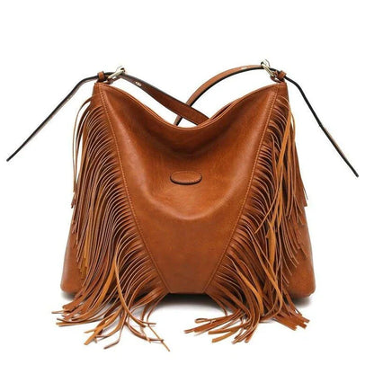 Chic vegan leather shoulder bag with tassel decoration, featuring a spacious interior and versatile carrying options