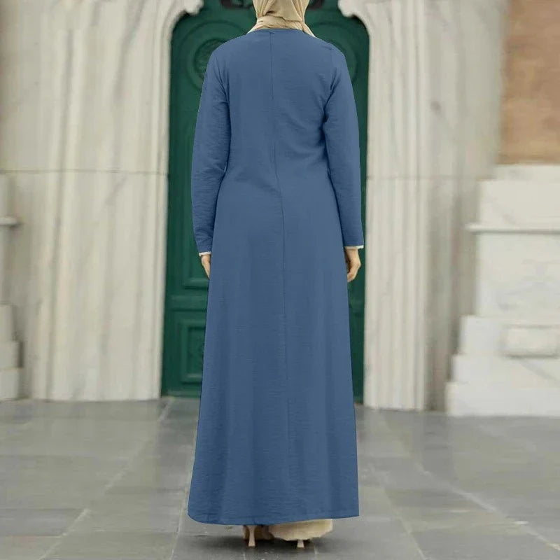 Elegant polyester dress with long sleeves, high slit hem, and available in caramel, black, blue, green, and pink colors