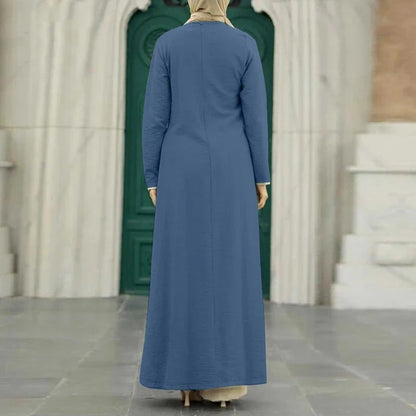 Elegant polyester dress with long sleeves, high slit hem, and available in caramel, black, blue, green, and pink colors