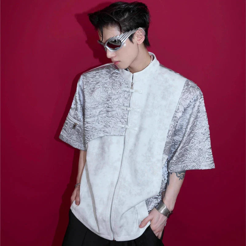 A black and white t-shirt with padded shoulders and a buckle design, offering a relaxed and comfortable fit.