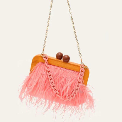 Elegant green feather evening clutch with chic acrylic chain, a stylish and practical accessory for formal and casual events