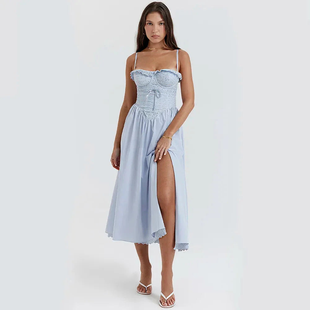 A stylish blue midi crochet dress with a floral pattern and spaghetti straps, perfect for summer occasions.