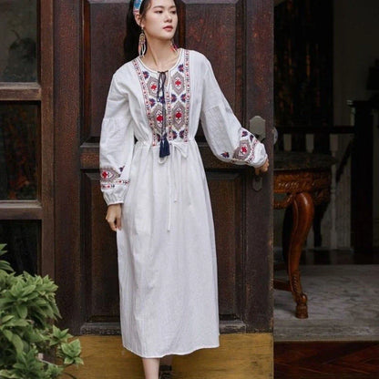 Elegant embroidered cotton-linen dress with tassels, featuring a waist-cinching A-line silhouette in vibrant colors