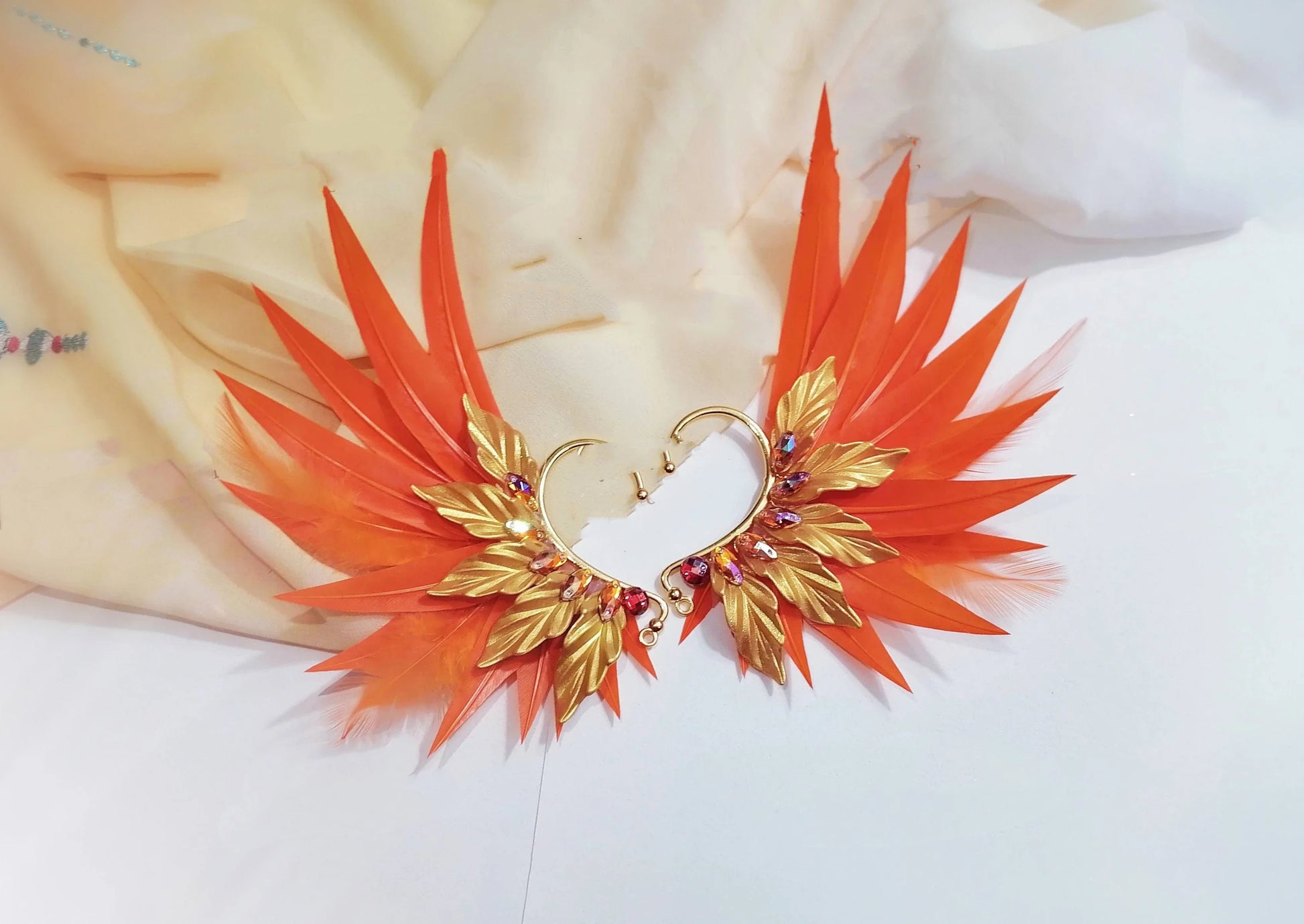 Elegant feather earrings with delicate angel wing design in various color options