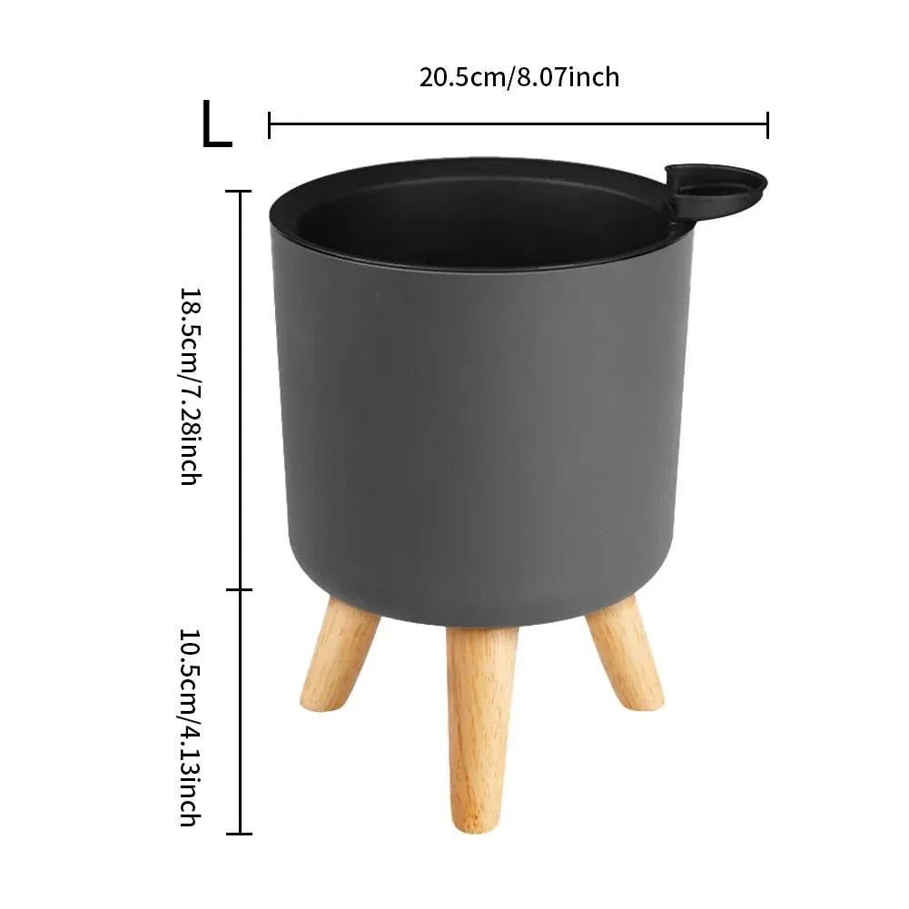 A modern self-watering planter with a wooden stand, designed to simplify indoor gardening and enhance any space with its chic and functional features.