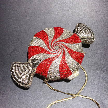 A stylish candy-shaped bag adorned with sparkling rhinestones, featuring a compact and versatile design perfect for everyday use.