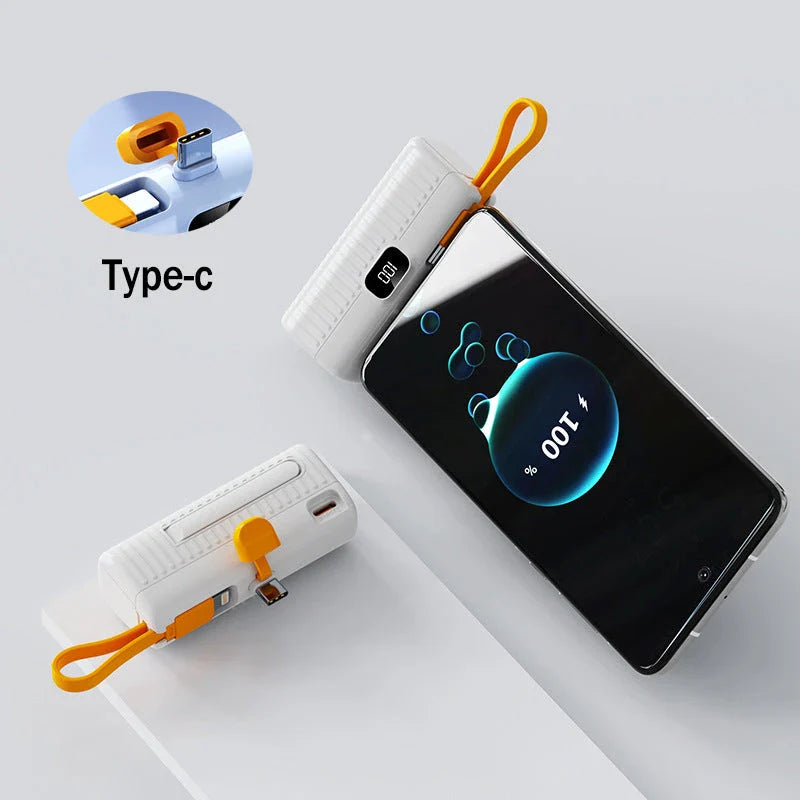 A compact, dual-port 30,000mAh power bank with built-in charging cables and fast charging capabilities.