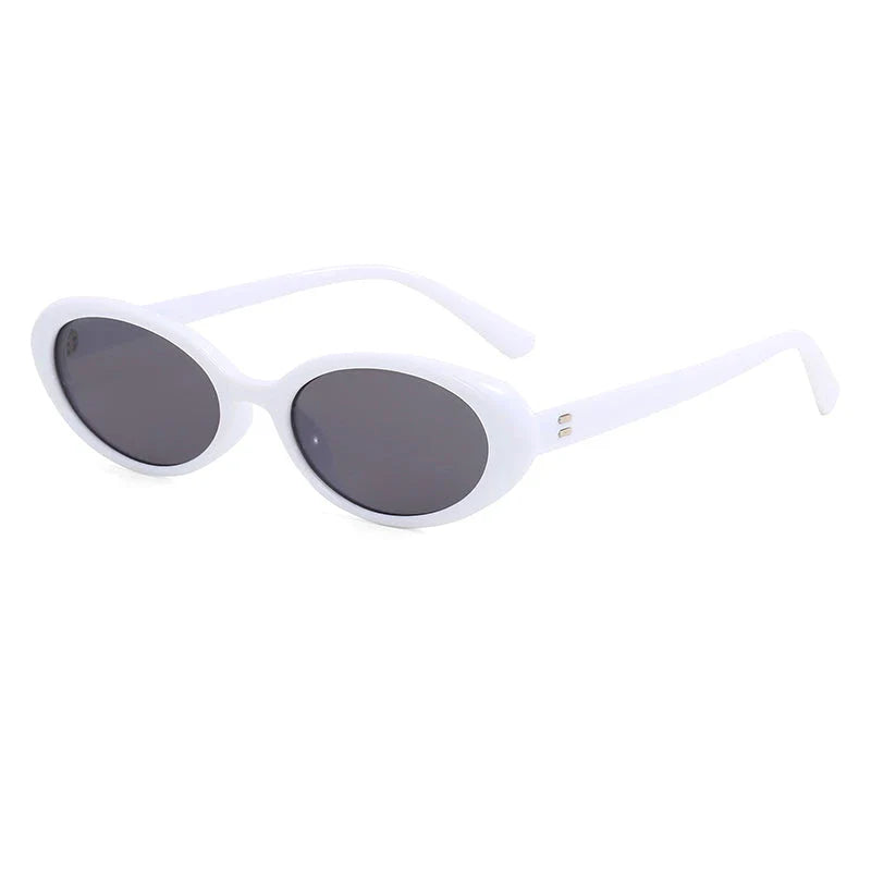 Chic oval sunglasses with white grey acetate frames and polycarbonate lenses, designed for fashionable women to shield their eyes from UV rays in style.