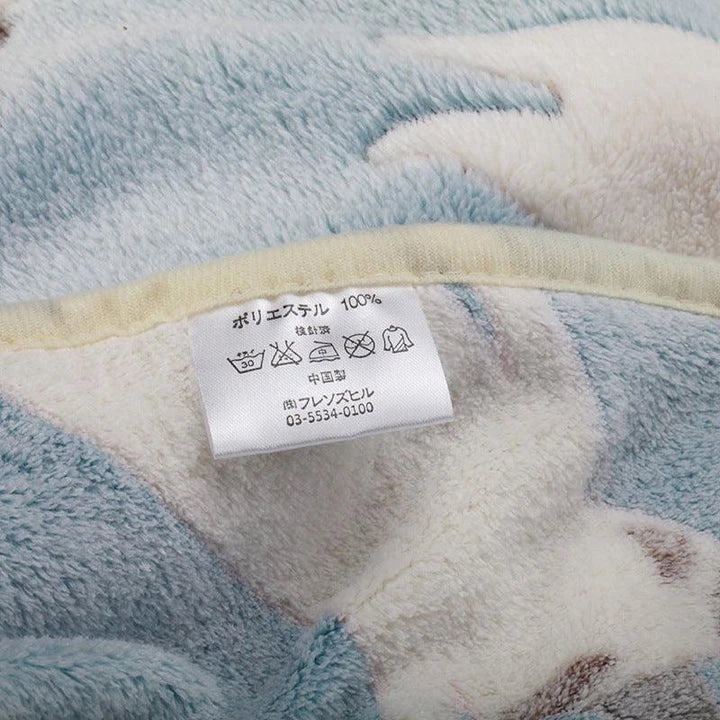 Cozy oversized fleece blanket in light blue and pink colors, suitable for both human and pet use