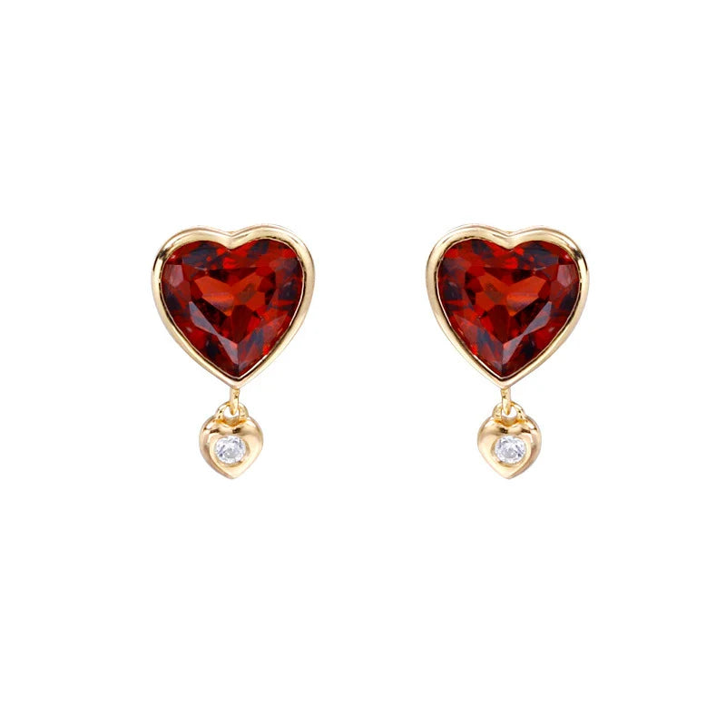 Elegant heart-shaped earrings with natural garnet and zircon stones in a pomegranate color, showcasing a timeless, versatile design.