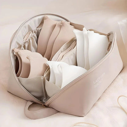Compact travel underwear and lingerie organizer bag made of durable polyester for organized storage of bras, underwear, and socks while on the go.