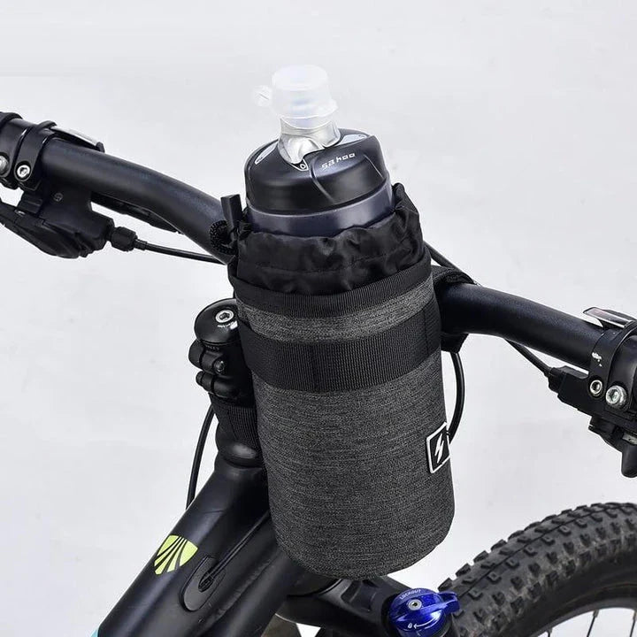 Insulated gray handlebar bag securely holding a 750ml water bottle, designed for easy access to hydration while cycling