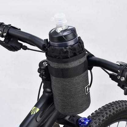 Insulated gray handlebar bag securely holding a 750ml water bottle, designed for easy access to hydration while cycling