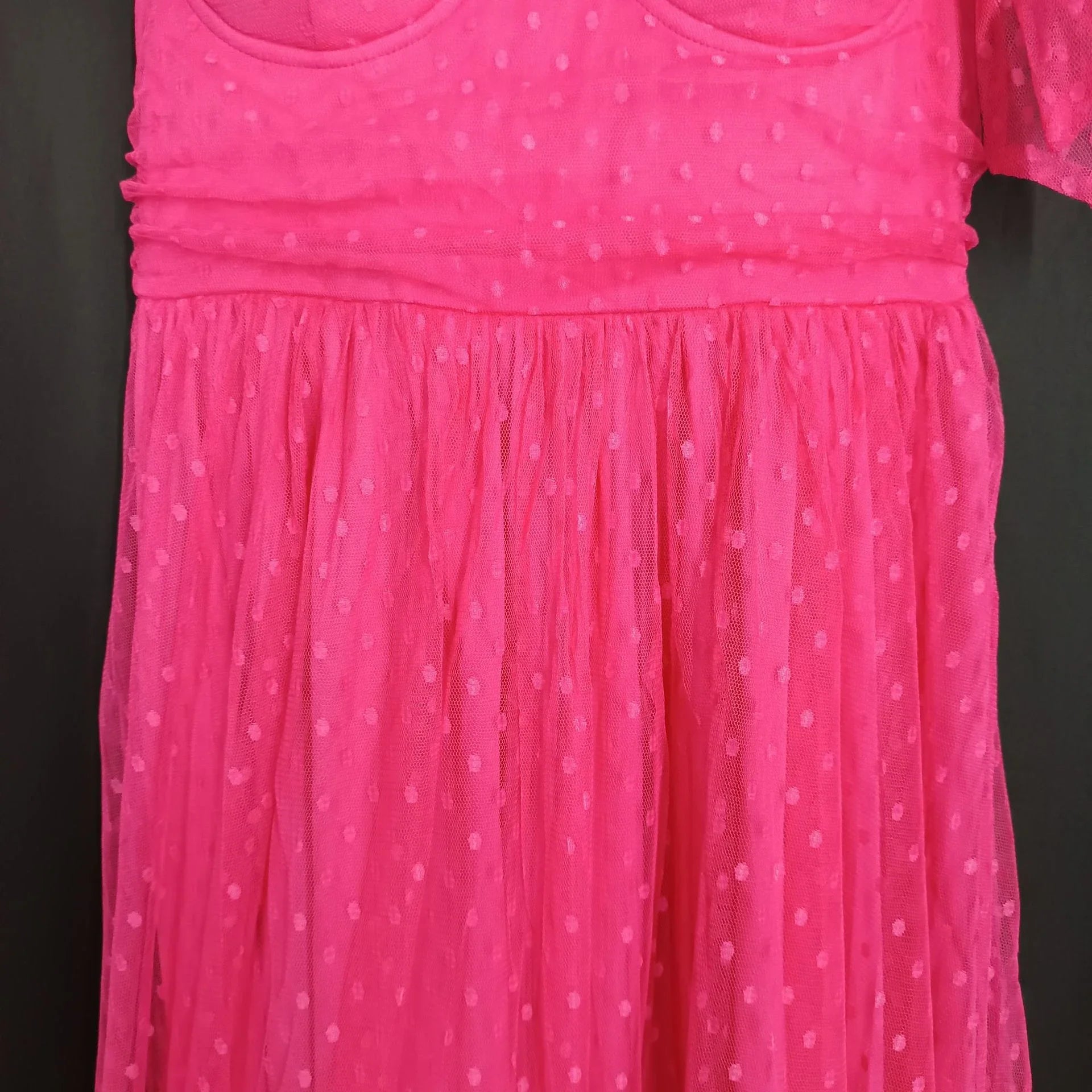 Fairy-inspired dress with mid-length silhouette, lace-up details, and luxurious polyester fabric
