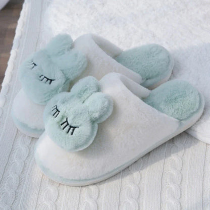 Cozy cotton slippers in a soft pink color, featuring a plush, non-slip design for comfortable home wear