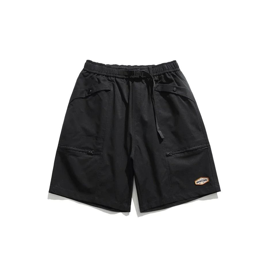 Mountain Vintage Workwear Shorts in black, orange, and army green colors, featuring a fifth-length design and convenient pockets for versatile functionality.