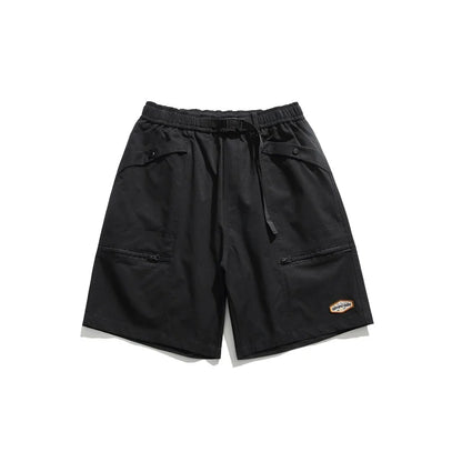 Mountain Vintage Workwear Shorts in black, orange, and army green colors, featuring a fifth-length design and convenient pockets for versatile functionality.