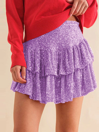 A shimmering sequin-embellished pleated skirt in a stylish rose red color, perfect for party nights and special occasions.