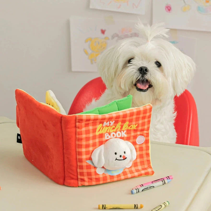 Interactive dog toy book with hidden treat compartments and a built-in squeaker for mental stimulation and enrichment