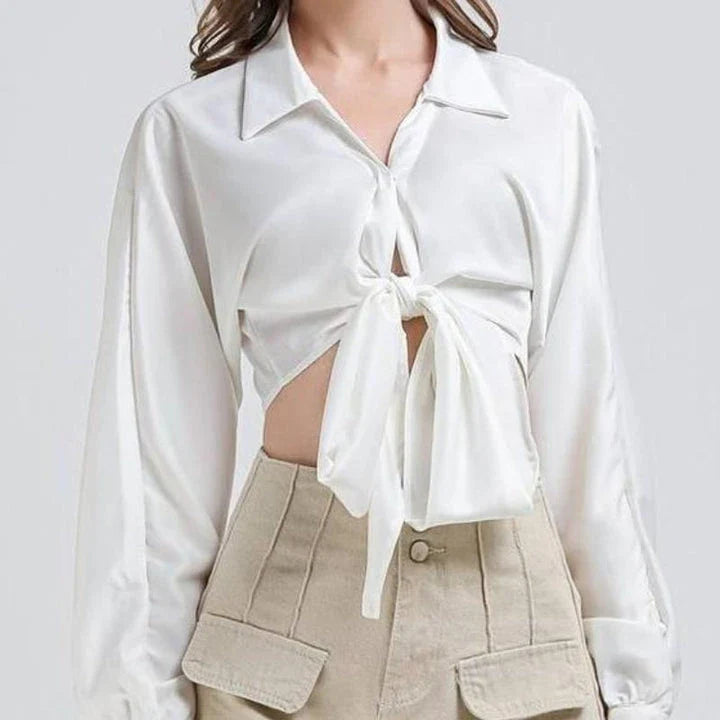 Elegant white vintage-inspired crop blouse with v-neck and long sleeves, a timeless and versatile wardrobe essential