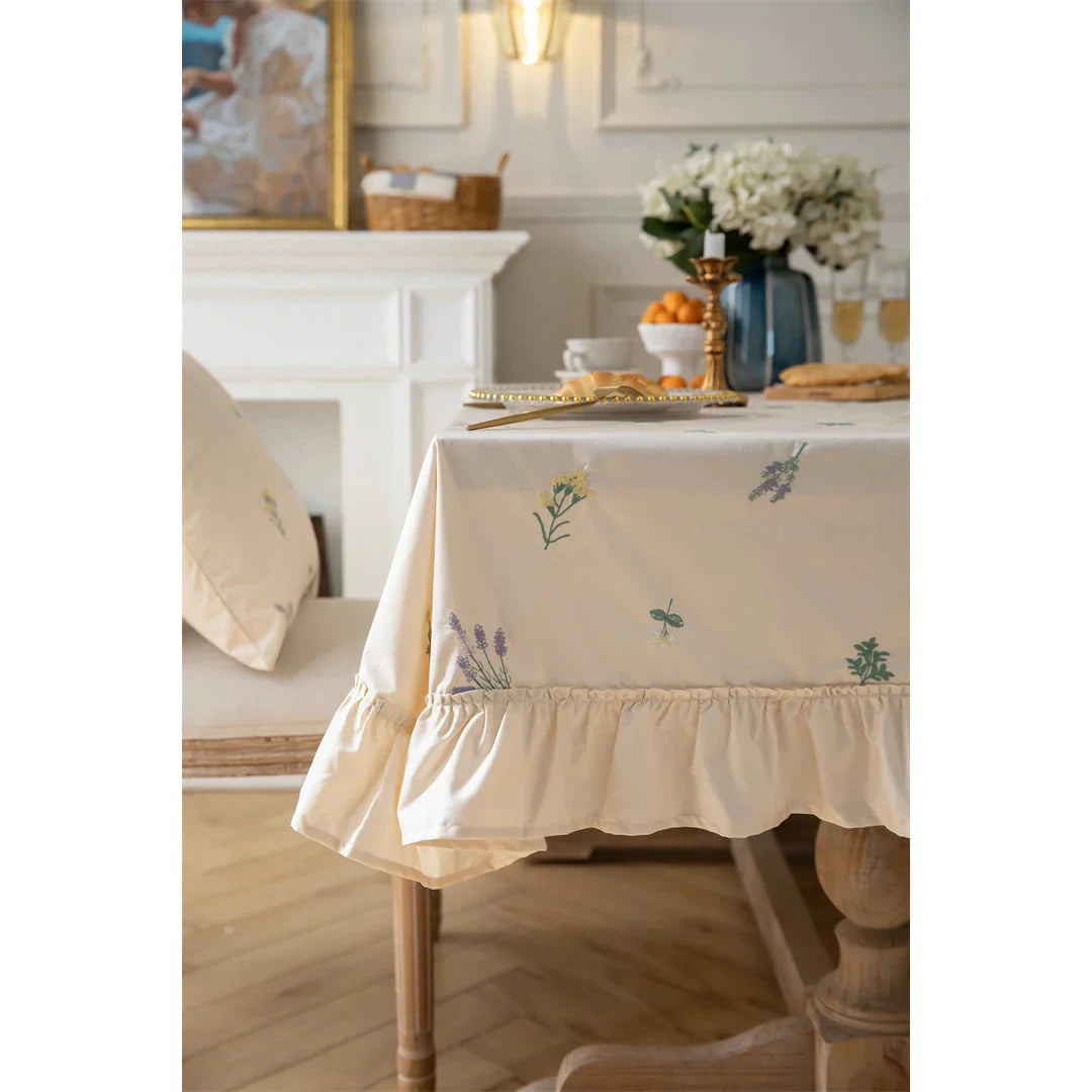 Elegant cotton tablecloth with apricot embroidery and lotus leaf edge, perfect for dining decor