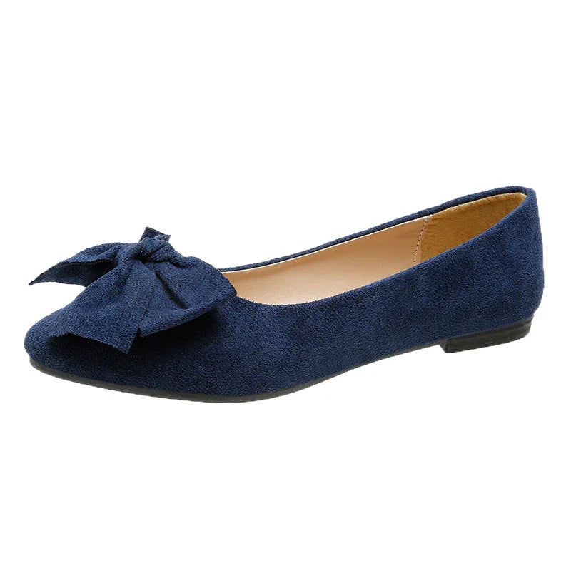 Fashionable flat shoes with bow accent, pointed toe, and low heel for comfortable, slip-on wear
