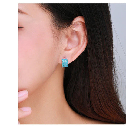 Pair of elegant silver hoop earrings with a micro-insert design, perfect for adding a touch of sophistication to any outfit.