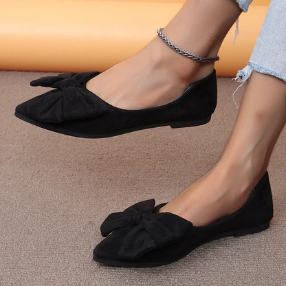 Fashionable flat shoes with bow accent, pointed toe, and low heel for comfortable, slip-on wear