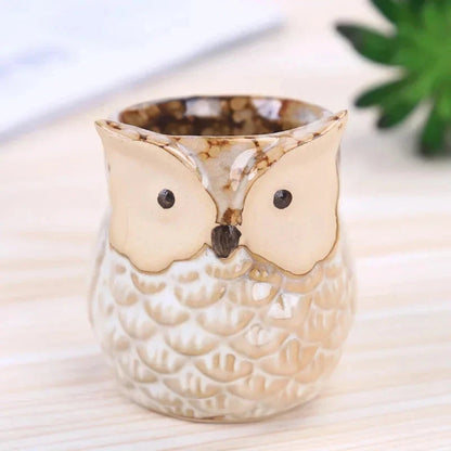 Adorable mini owl-shaped ceramic planter for small plants and succulents, featuring vibrant colors and vintage charm
