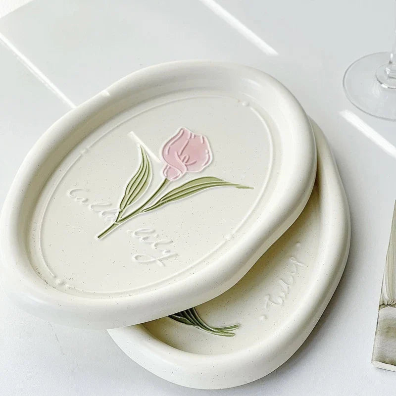 Elegant ceramic plate featuring a delicate floral relief design of Calla Lily and Tulip flowers, perfect for refined dining