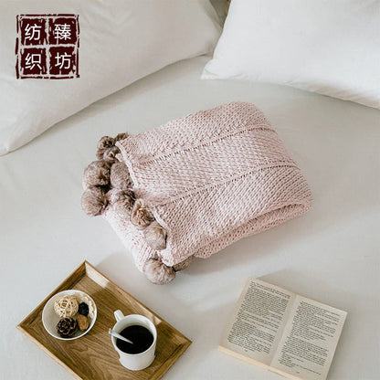 Cozy chenille ball-knit wool blanket in pink, gray, and white colors