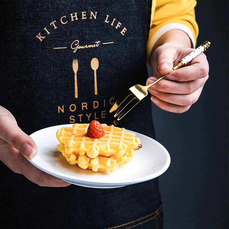 Elegant gold-plated dessert fork with intricate ceramic handle design