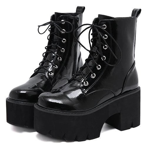 A pair of stylish lace-up high heel boots in black, featuring a sleek design and microfiber interior for comfort.