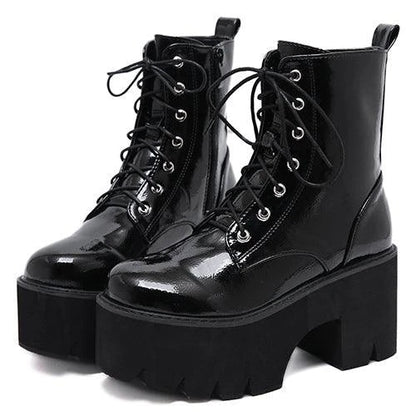 A pair of stylish lace-up high heel boots in black, featuring a sleek design and microfiber interior for comfort.